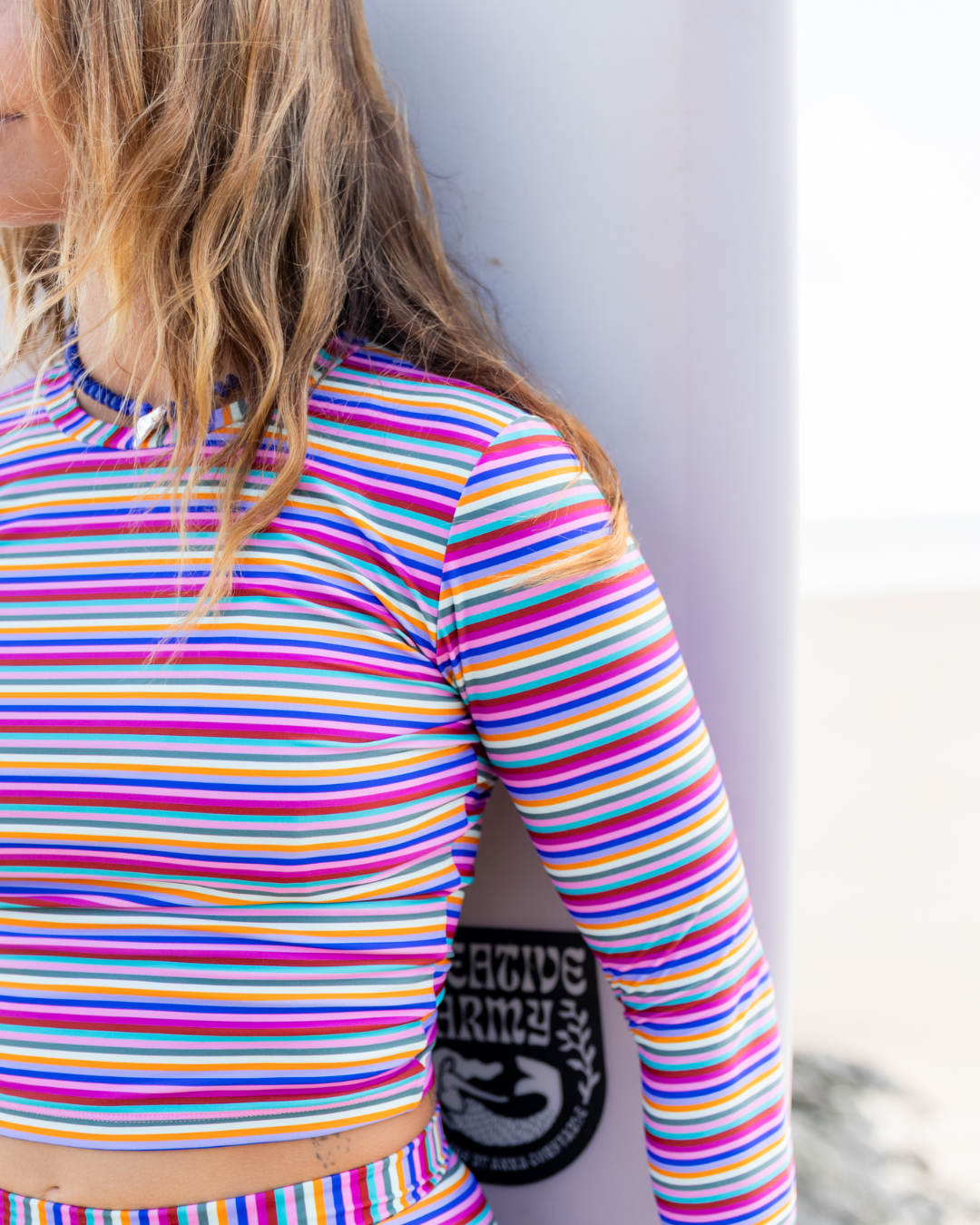 Women's long sleeve rashie in Electric Dusk print, by Sunfolk Swimwear Australia