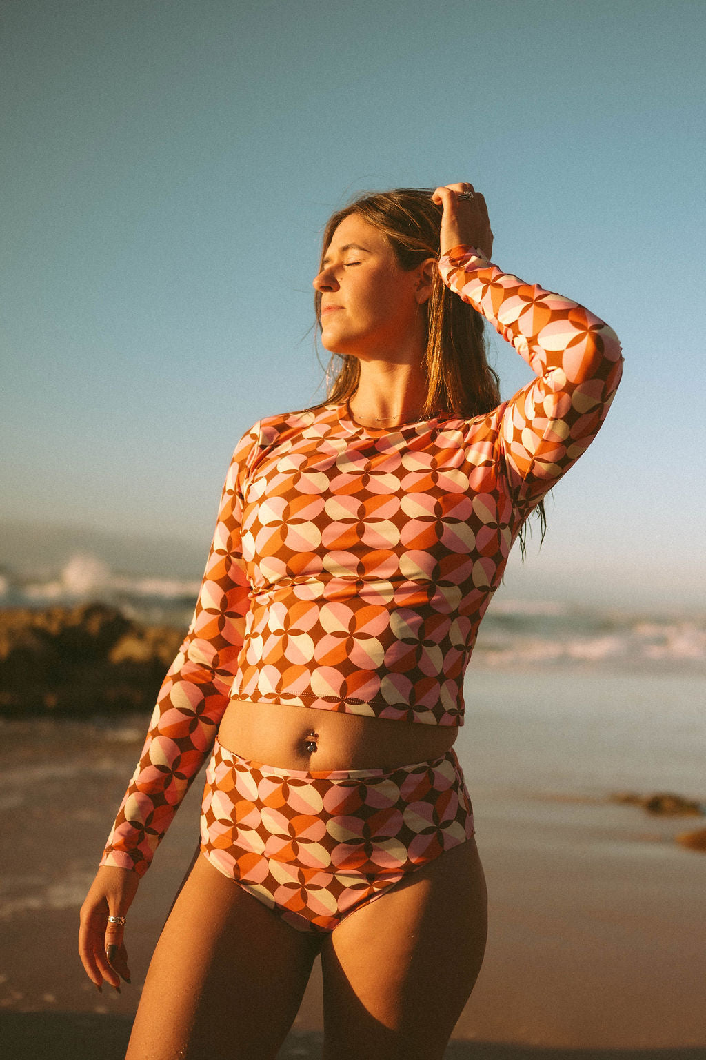 Women's long sleeve rashie in Sunburst print, by Sunfolk Swimwear Australia