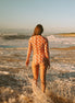 Women's long sleeve rashie in Sunburst print, by Sunfolk Swimwear Australia