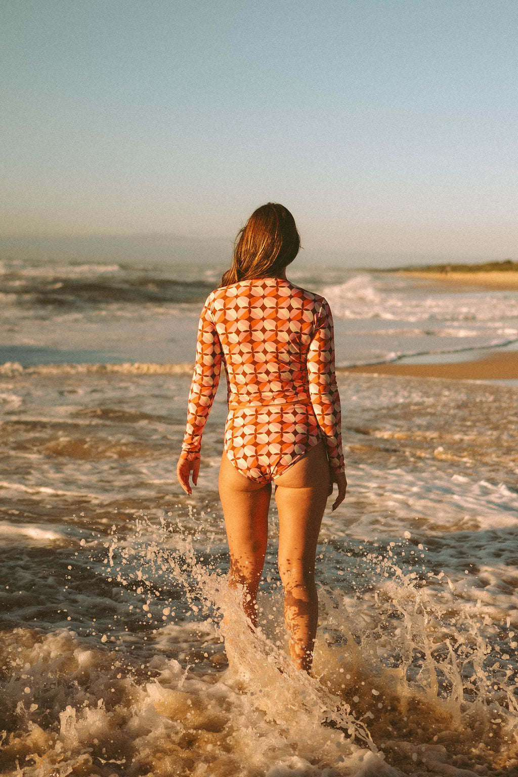 Women's long sleeve rashie in Sunburst print, by Sunfolk Swimwear Australia