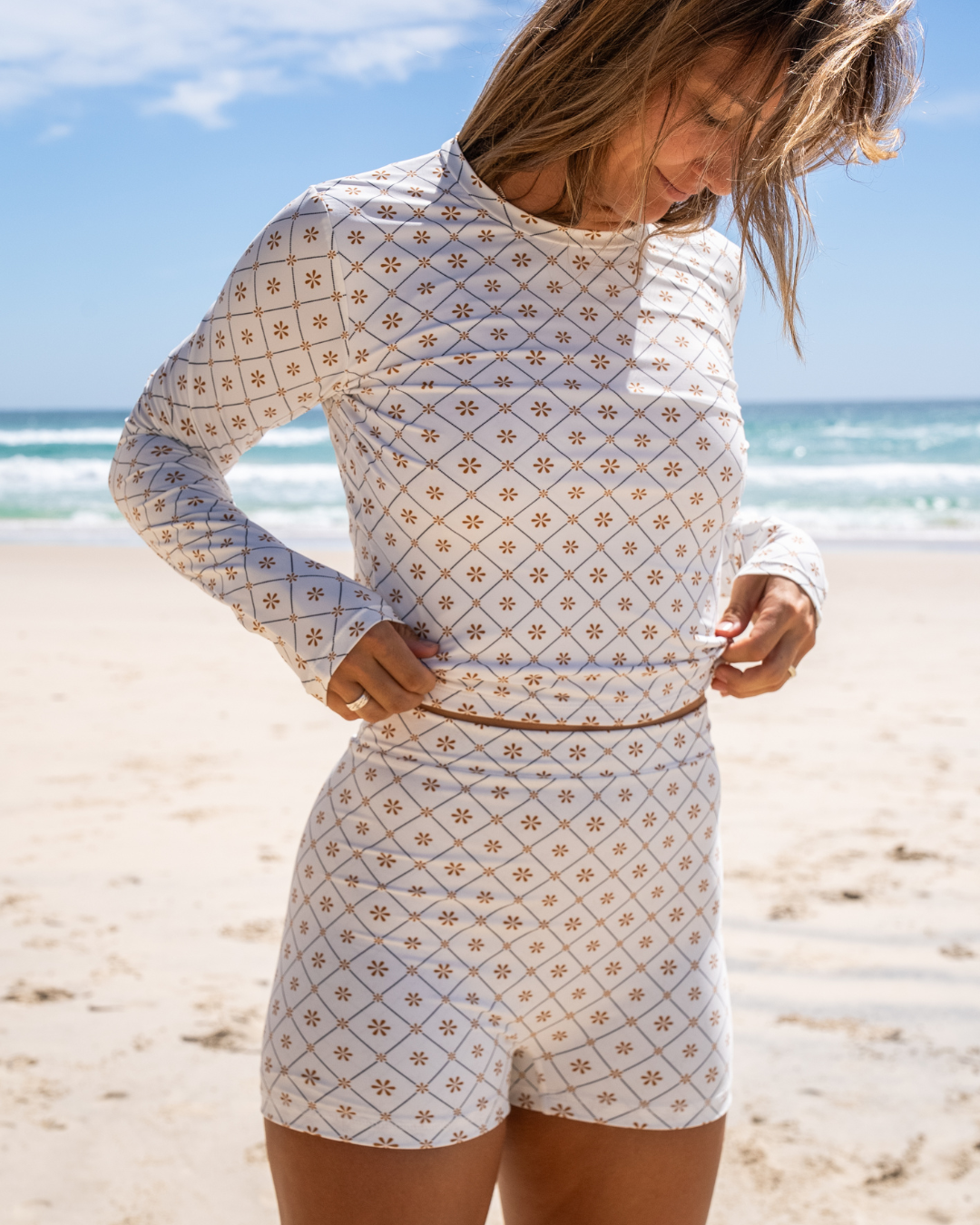 Women's long sleeve rashie in Dune Daisy print, by Sunfolk Swimwear Australia