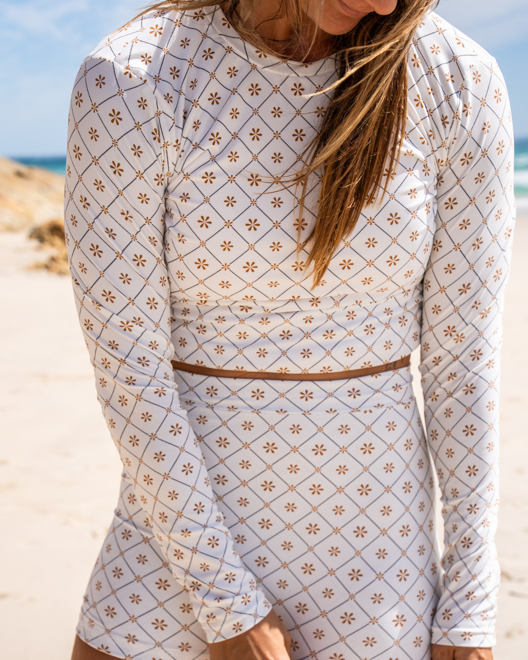 Women's long sleeve rashie in Dune Daisy print, by Sunfolk Swimwear Australia