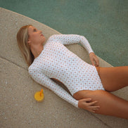 Women's long sleeve surf suit and swimsuit  in Dune Daisy print, by Sunfolk Swimwear Australia