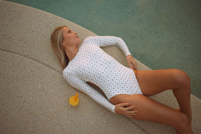 Women's long sleeve surf suit and swimsuit  in Dune Daisy print, by Sunfolk Swimwear Australia