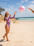Women's long sleeve surf suit and swimsuit  in Electric Dusk print, by Sunfolk Swimwear Australia